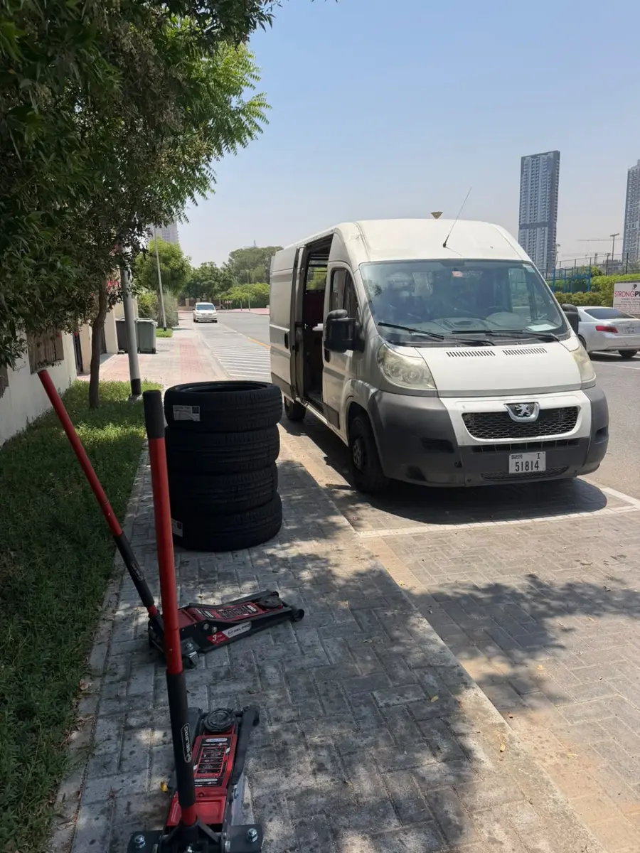 Onsite Mobile Car Care tyre service van with new tyres and hydraulic jacks in Dubai