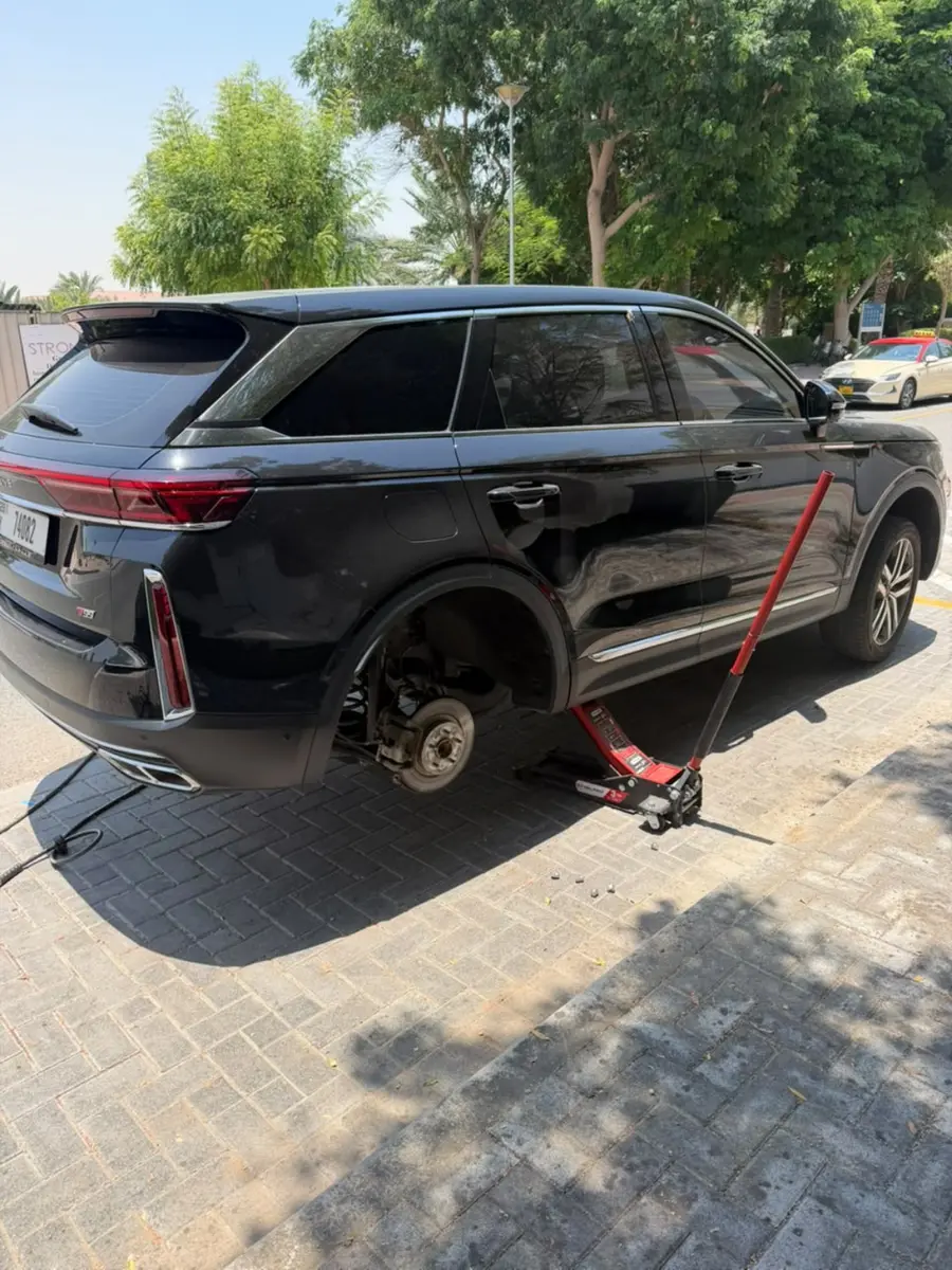 SUV raised safely for a mobile tyre replacement service in Dubai